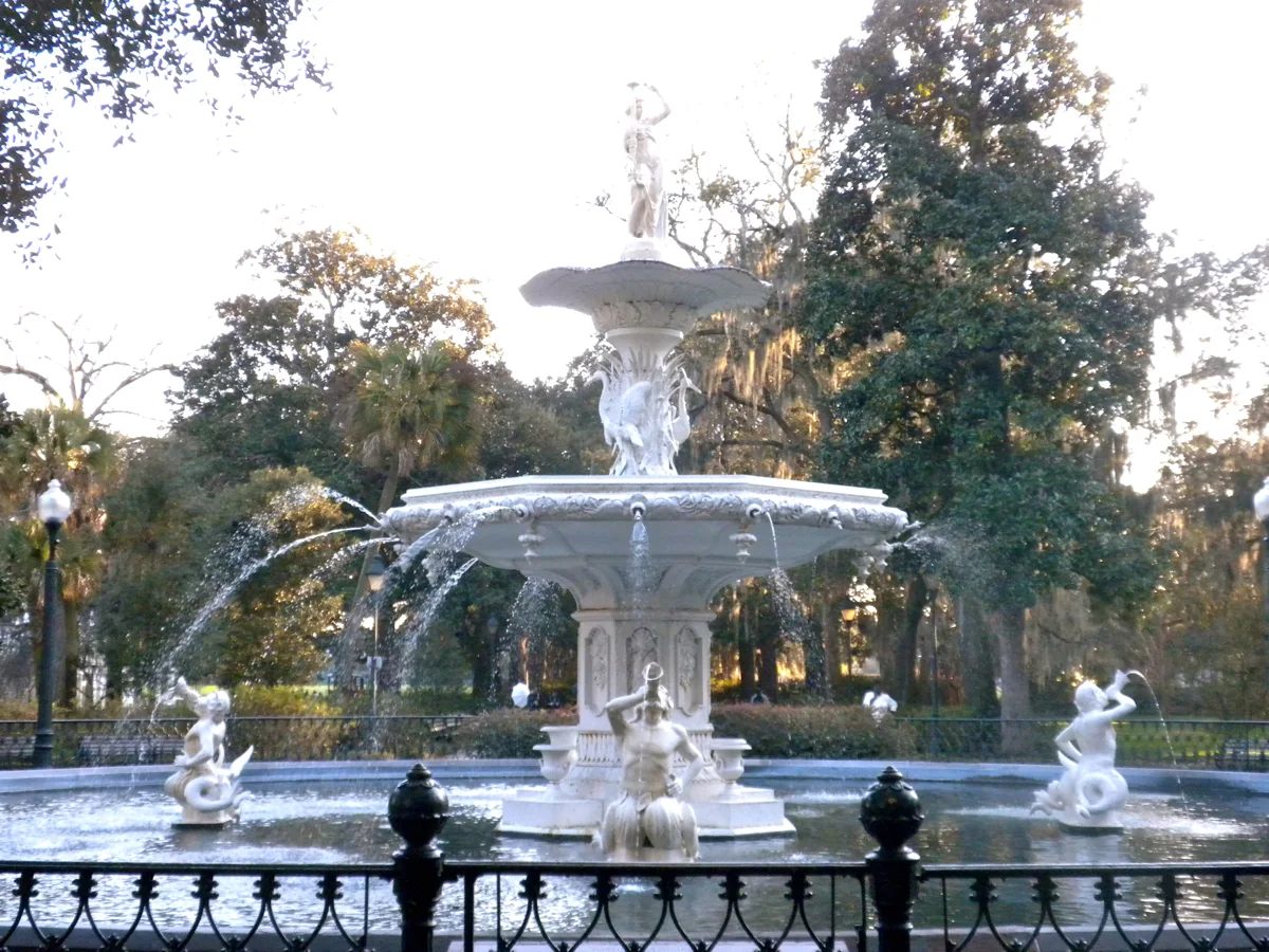 The Forsyth Park fountain under live oaks, a family stop for visitors after ghost tours in Savannah GA